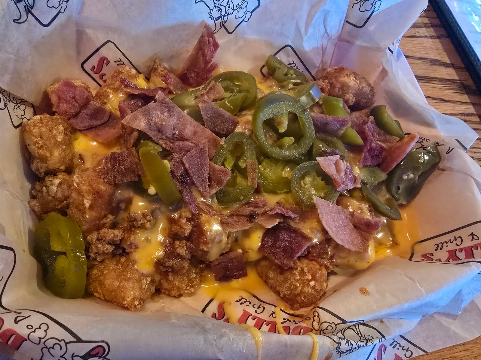 Totchos: tater tots with cheese sauce and jalapeños